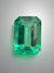 2.31 Carat 10x7 Freckled Medium Green Emerald Cut Colombian Emerald