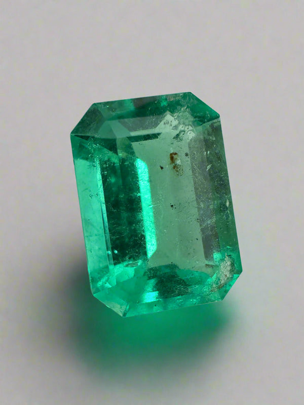 2.31 Carat 10x7 Freckled Medium Green Emerald Cut Colombian Emerald