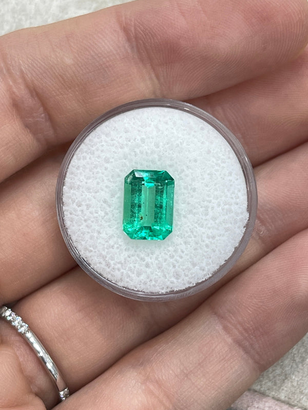 2.31 Carat 10x7 Freckled Medium Green Emerald Cut Colombian Emerald