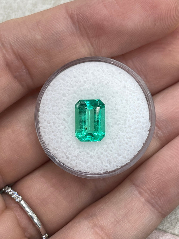 2.31 Carat 10x7 Freckled Medium Green Emerald Cut Colombian Emerald