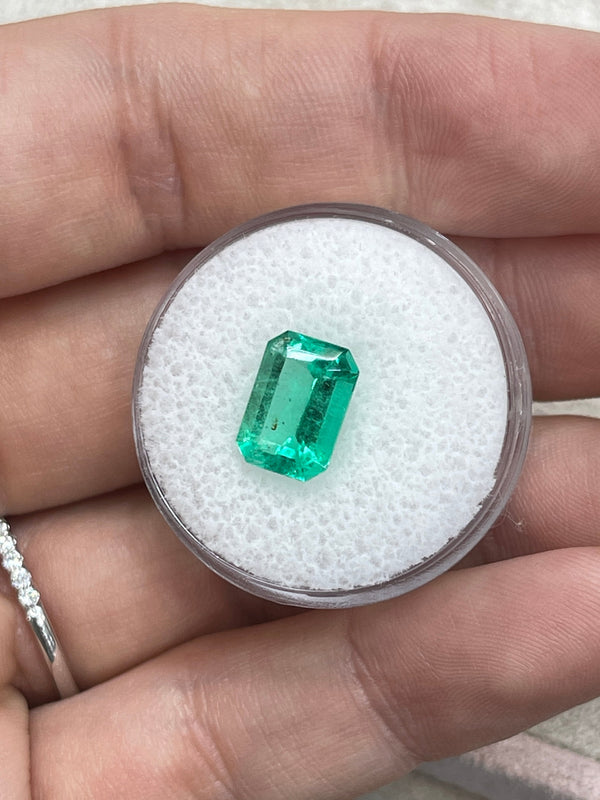 2.31 Carat 10x7 Freckled Medium Green Emerald Cut Colombian Emerald